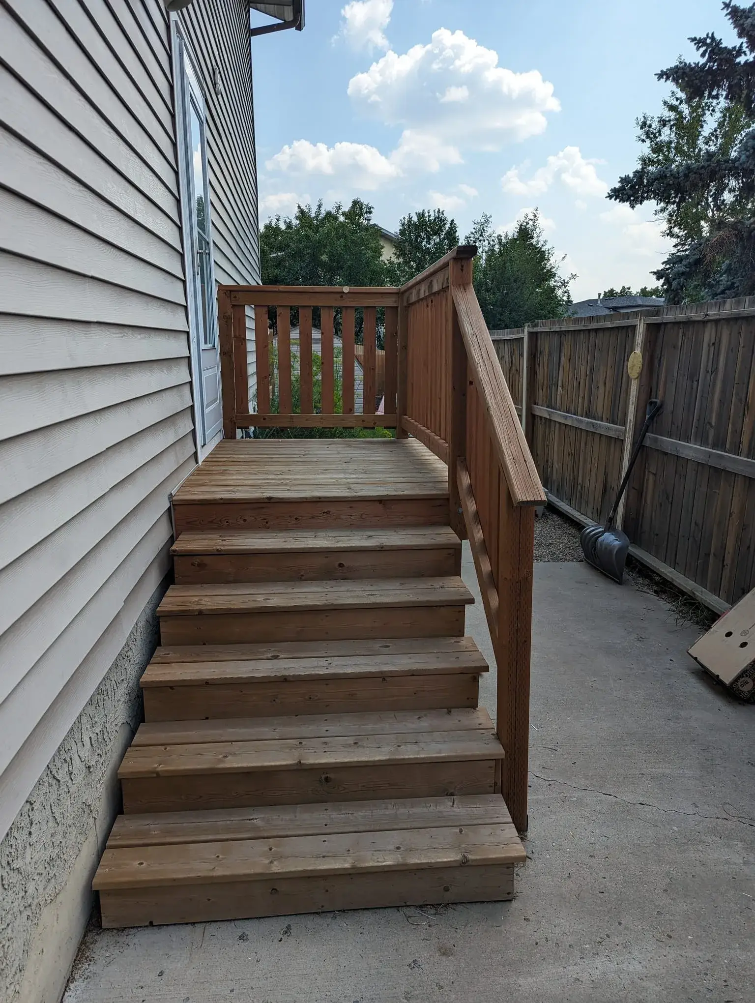 Wooden entryway steps leading to the deck