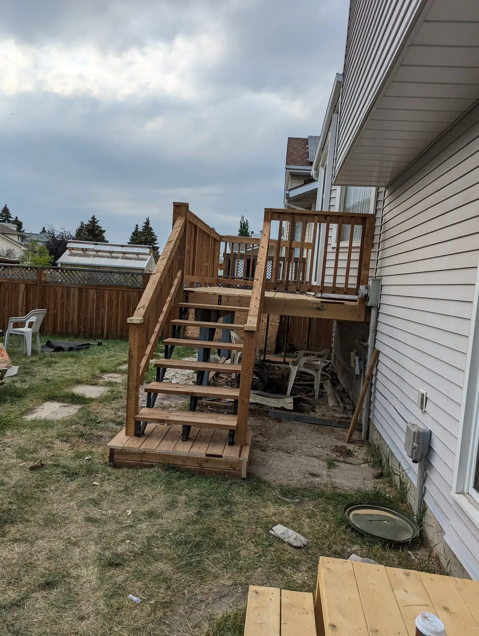 Raised deck framing viewed from the yard