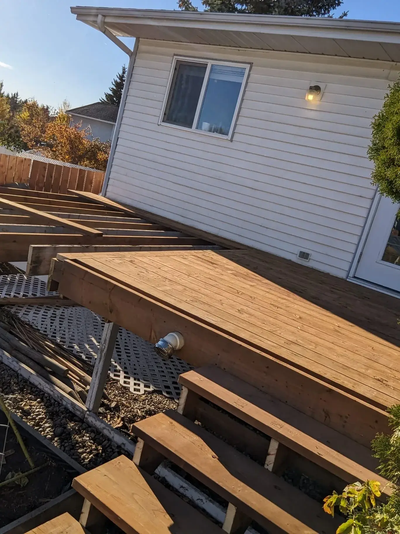 Deck framing underway in the backyard