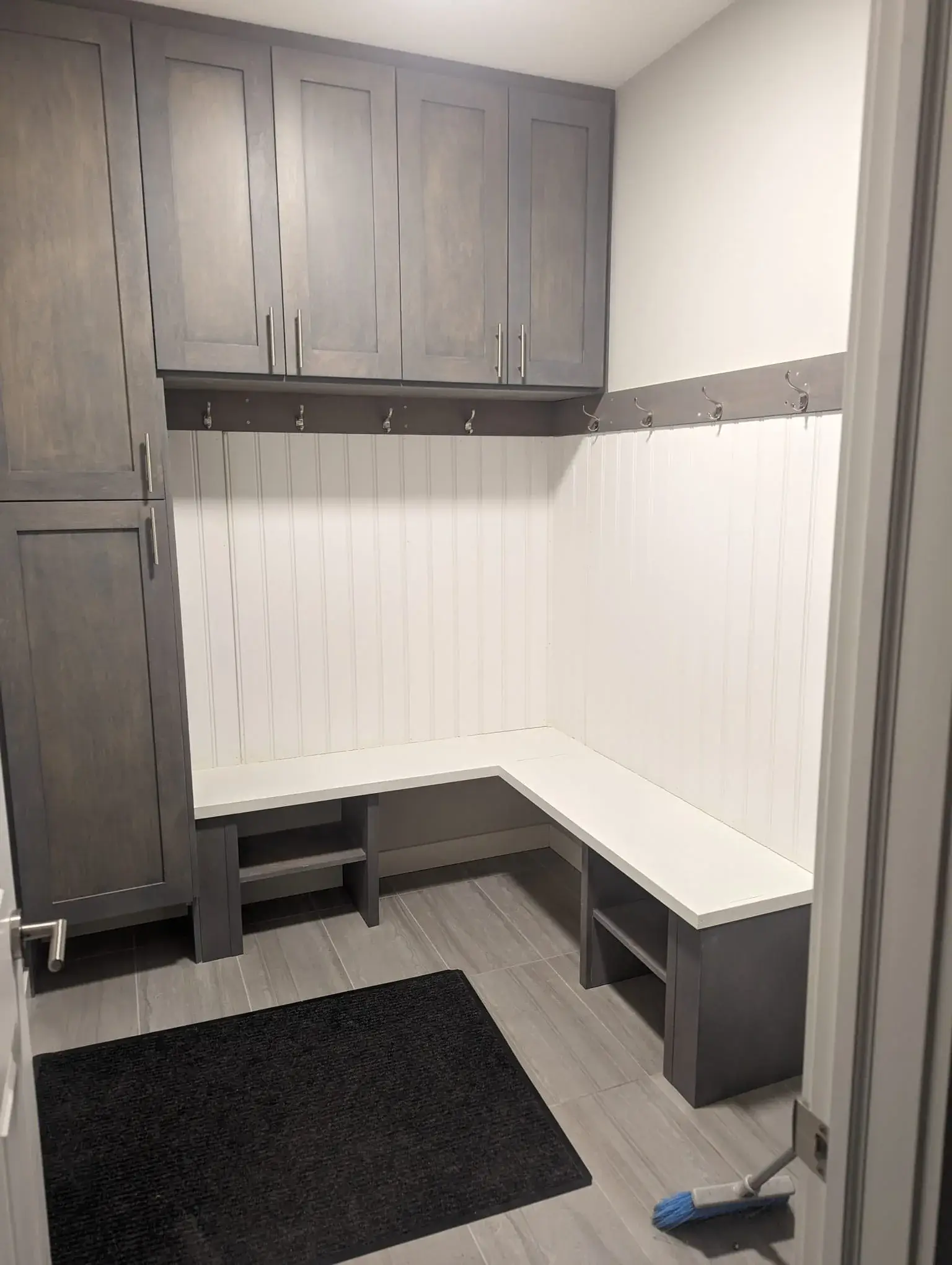 Interior mudroom with bench and cabinets